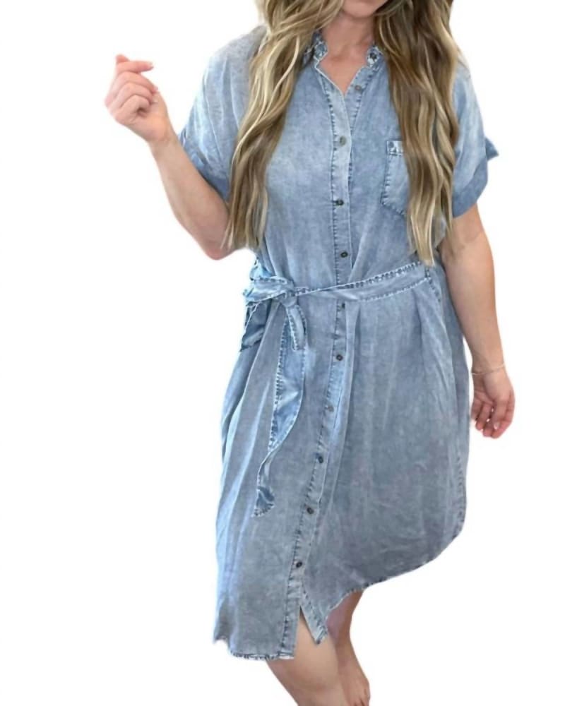 Front of a model wearing a size L Alanna Short Sleeve Button Down Denim Dress In Blue in Blue by Doe and Rae. | dia_product_style_image_id:360715